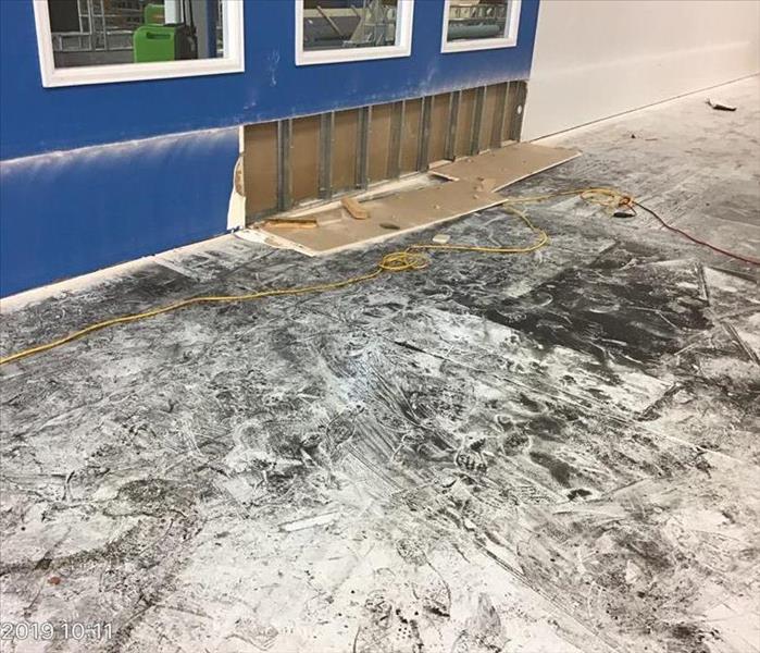 Affected commercial flooring and drywall.